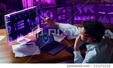Analyst in smart glasses points at neon purple AI dashboards with futuristic interface. Collage 131272228