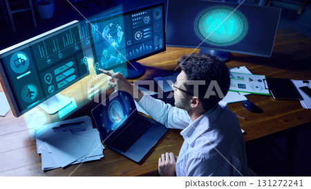 Professional researcher analyzing AI logistics dashboard with futuristic holographic interface. Collage Professional researcher analyzing AI logistics dashboard with futuristic holographic interface. Collage 131272241