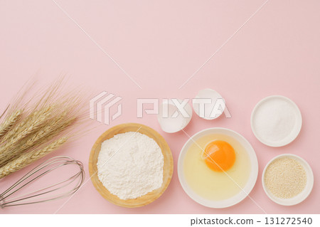 Cooking and baking image (flour, eggs, salt, brown sugar, wheat ears) pink background Cooking and baking image (flour, eggs, salt, brown sugar, wheat ears) pink background 131272540
