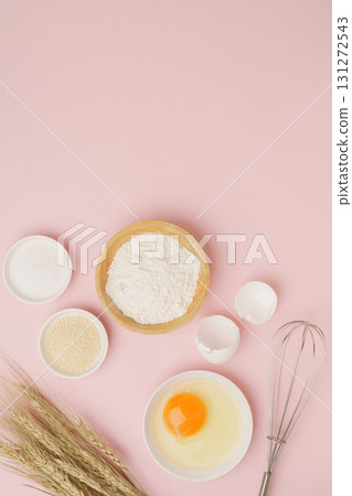 Cooking and baking image (flour, eggs, salt, brown sugar, wheat ears) pink background Cooking and baking image (flour, eggs, salt, brown sugar, wheat ears) pink background 131272543