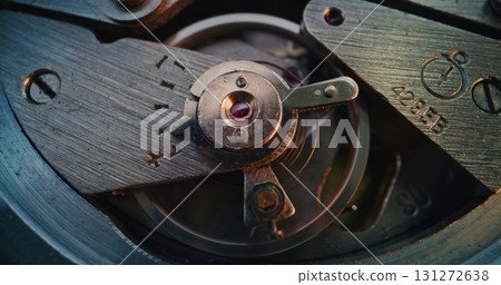 Macro Shot of Mechanical Clock Movement Showing Gears, Wheels and Balance Mechanism Macro Shot of Mechanical Clock Movement Showing Gears, Wheels and Balance Mechanism 131272638