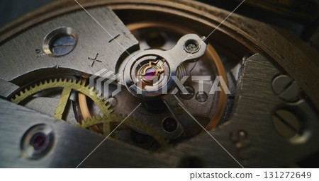 Macro Close Up Shot of Intricate Watch Mechanism. Detailed Look Into Clock Mechanical Engineering Macro Close Up Shot of Intricate Watch Mechanism. Detailed Look Into Clock Mechanical Engineering 131272649