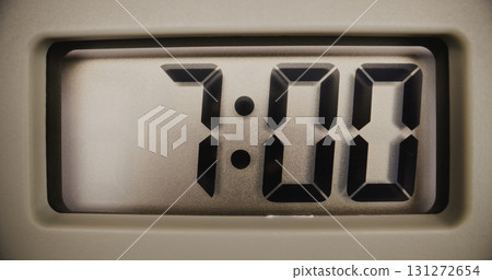 Close Up of Digital Clock with Bright Display Showing Precise Time in Morning Close Up of Digital Clock with Bright Display Showing Precise Time in Morning 131272654