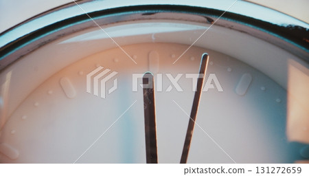 Close Up of Moving Clock Hands Showing Precise Time on Wall Clock with Minimalist Design 131272659