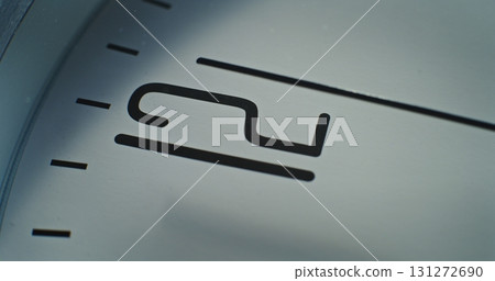 Macro Close Up Shot of Number 12 on the Dial and Running Second Hand on Minimalist Wall Clock Macro Close Up Shot of Number 12 on the Dial and Running Second Hand on Minimalist Wall Clock 131272690