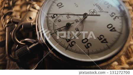 Macro Close Up Shot of Mechanical Stopwatch with Metallic Case and Dial with Running Second Hand Macro Close Up Shot of Mechanical Stopwatch with Metallic Case and Dial with Running Second Hand 131272700