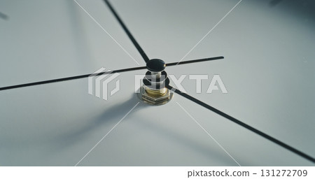 Macro Close Up Shot of Minimalist White Wall Clock. Modern Design Element of Interior Macro Close Up Shot of Minimalist White Wall Clock. Modern Design Element of Interior 131272709