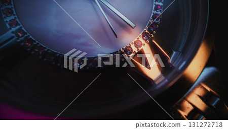 Close Up of Elegant Wristwatch with Gemstone Bezel and Metallic Bracelet Showing Precise Time Close Up of Elegant Wristwatch with Gemstone Bezel and Metallic Bracelet Showing Precise Time 131272718