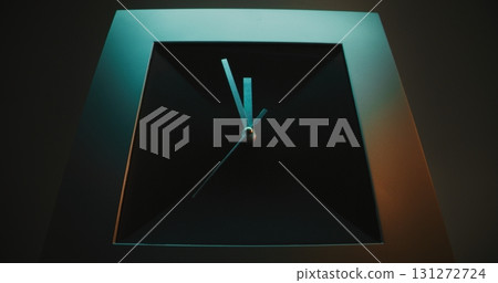 Close Up of Square Wall Clock with Futuristic Design on Gray Background Close Up of Square Wall Clock with Futuristic Design on Gray Background 131272724