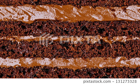 Detailed macro of rich chocolate cake layers with frosting Detailed macro of rich chocolate cake layers with frosting 131273328