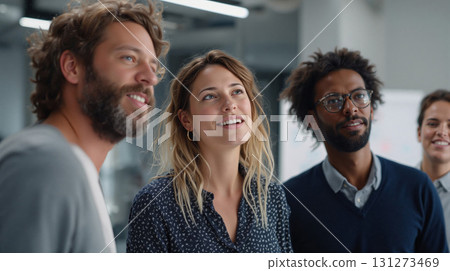 Diverse professionals collaborate in a modern office space during a team meeting to discuss ideas and strategies 131273469