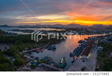 Aerial view of Vibrant Sunset Over Coastal Fishing harbor Aerial view of Vibrant Sunset Over Coastal Fishing harbor 131273881