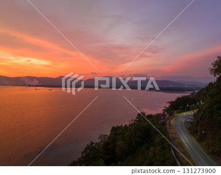 aerial view sunset landscape Amazing light of nature cloudscape sky above Phuket sea. aerial view sunset landscape Amazing light of nature cloudscape sky above Phuket sea. 131273900