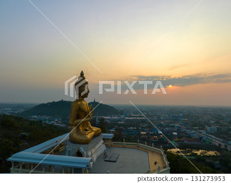 aerial view scenery sky in sunrise above the golden big buddha. aerial view scenery sky in sunrise above the golden big buddha. 131273953