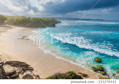 Luxury beach with ocean and cloudy sky with sun light in Lembongan island Luxury beach with ocean and cloudy sky with sun light in Lembongan island 131274331