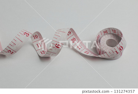 A measuring tape is displayed on a white 131274357