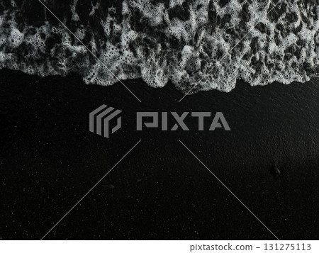 Waves crashing on black volcanic sand at Tenerife beach Waves crashing on black volcanic sand at Tenerife beach 131275113