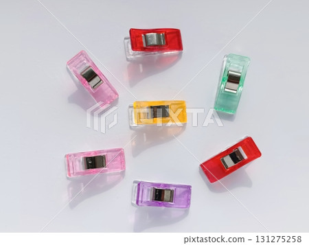 Clips for cutting and sewing. Sewing clips of different colors made of plastic. Clips for cutting and sewing. Sewing clips of different colors made of plastic. 131275258
