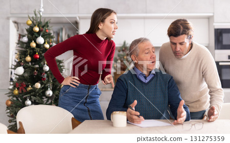 Couple discussing inheritance with older man Couple discussing inheritance with older man 131275359