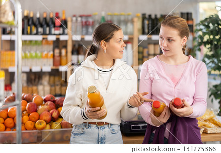 Two customers choose natural juices 131275366