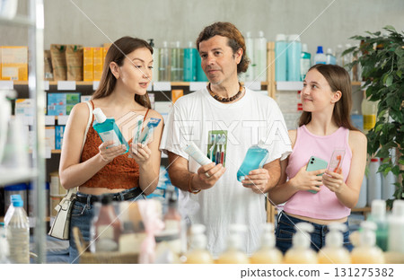 Family choose oral care products at pharmacy Family choose oral care products at pharmacy 131275382