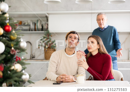 Elderly man quarreling with man and woman couple Elderly man quarreling with man and woman couple 131275583