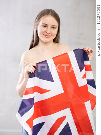 Young woman with UK flag posing in studio 131275591