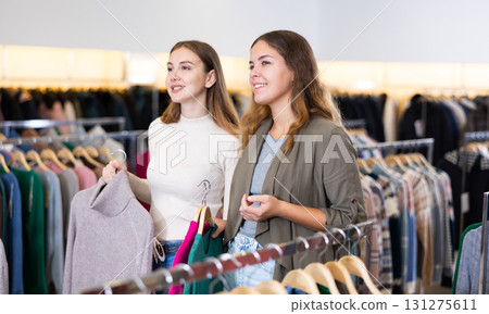 Two women shopping warm clothes in store 131275611