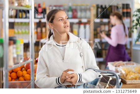 Young woman in supermarket 131275649