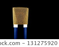 Closeup View of Blue and Gold Microphone Isolated on a Black Background 131275920