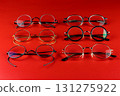 Selection of Old Fashioned Spectacle Frames on a Red Background 131275922