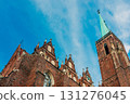 intricate facade of a Gothic church is set against a bright blue sky, wroclaw, Poland 131276045