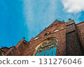 intricate facade of a Gothic church is set against a bright blue sky, wroclaw, Poland 131276046