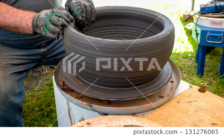 Potter Making Clay Pot on Pottery Wheel Potter Making Clay Pot on Pottery Wheel 131276065
