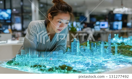 Urban planner analyzing futuristic hologram of smart city infrastructure 131277492