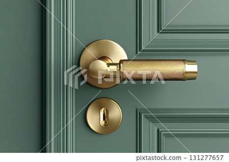 Golden door handle and keyhole on green wooden door 131277657