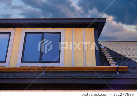 New house under construction features large windows modern exterior framework build new house New house under construction features large windows modern exterior framework build new house 131277689