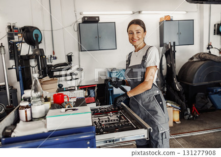 A Female Mechanic is Successfully Thriving and Working in a Modern Garage Environment Today A Female Mechanic is Successfully Thriving and Working in a Modern Garage Environment Today 131277908