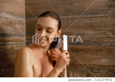 A Woman Enjoying a Truly Relaxing and Rejuvenating Shower Experience in Her Bathroom Space A Woman Enjoying a Truly Relaxing and Rejuvenating Shower Experience in Her Bathroom Space 131277972