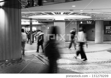 Monochrome blurred shots of people walking through the underground shopping mall in Umeda, Osaka 131278209