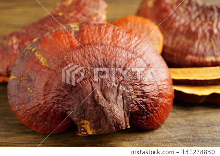 Lingzhi or Reishi mushroom with capsules, organic natural healthy food. Lingzhi or Reishi mushroom with capsules, organic natural healthy food. 131278830