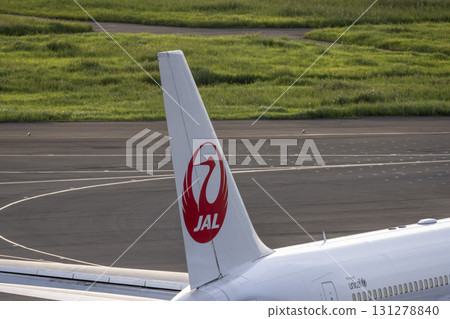 Haneda Airport at dusk, airplane taxiing, tail fin, Ota Ward, Tokyo 131278840