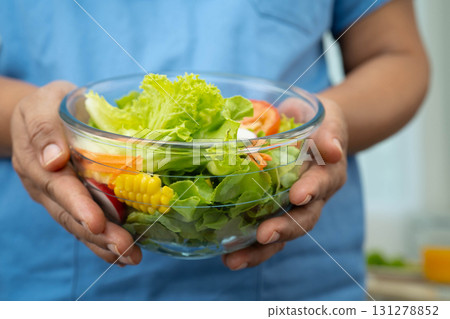 Asian Nutritionist holding healthy food for patient in hospital, nutrition and vitamin. 131278852
