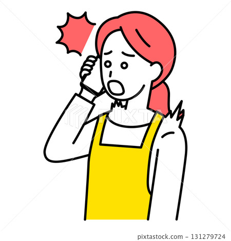 A woman in an apron surprised by a call on her smartphone 131279724