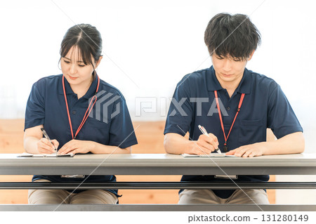 Male and female care workers and care managers receiving training (study group, meeting) 131280149