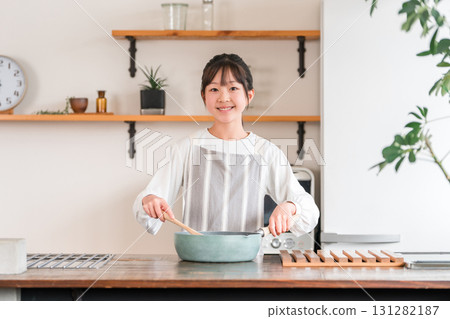 Children cooking in the kitchen at home (elementary school students, junior high school students, high school students, girls) Children cooking in the kitchen at home (elementary school students, junior high school students, high school students, girls) 131282187