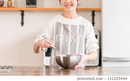 Children (elementary school, junior high school, high school, girls) enjoying making sweets in the kitchen at home Children (elementary school, junior high school, high school, girls) enjoying making sweets in the kitchen at home 131283494