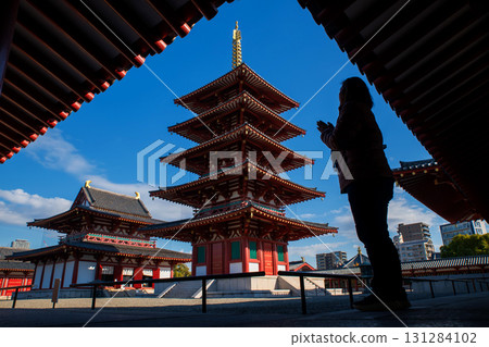 Asian woman sacred and pray at 5 Storied Pagoda of Shitennoj temple 131284102