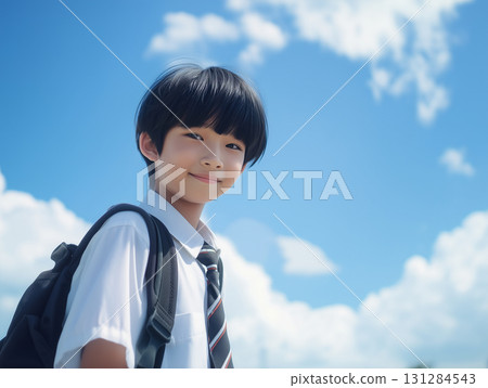Portrait of an elementary school boy walking to school under clear skies (educational advertising for children) Portrait of an elementary school boy walking to school under clear skies (educational advertising for children) 131284543