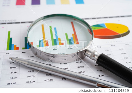 Magnifying glass on charts graphs paper. Financial development, Banking Account, Statistic, Investment Analytic research data economy. Magnifying glass on charts graphs paper. Financial development, Banking Account, Statistic, Investment Analytic research data economy. 131284839